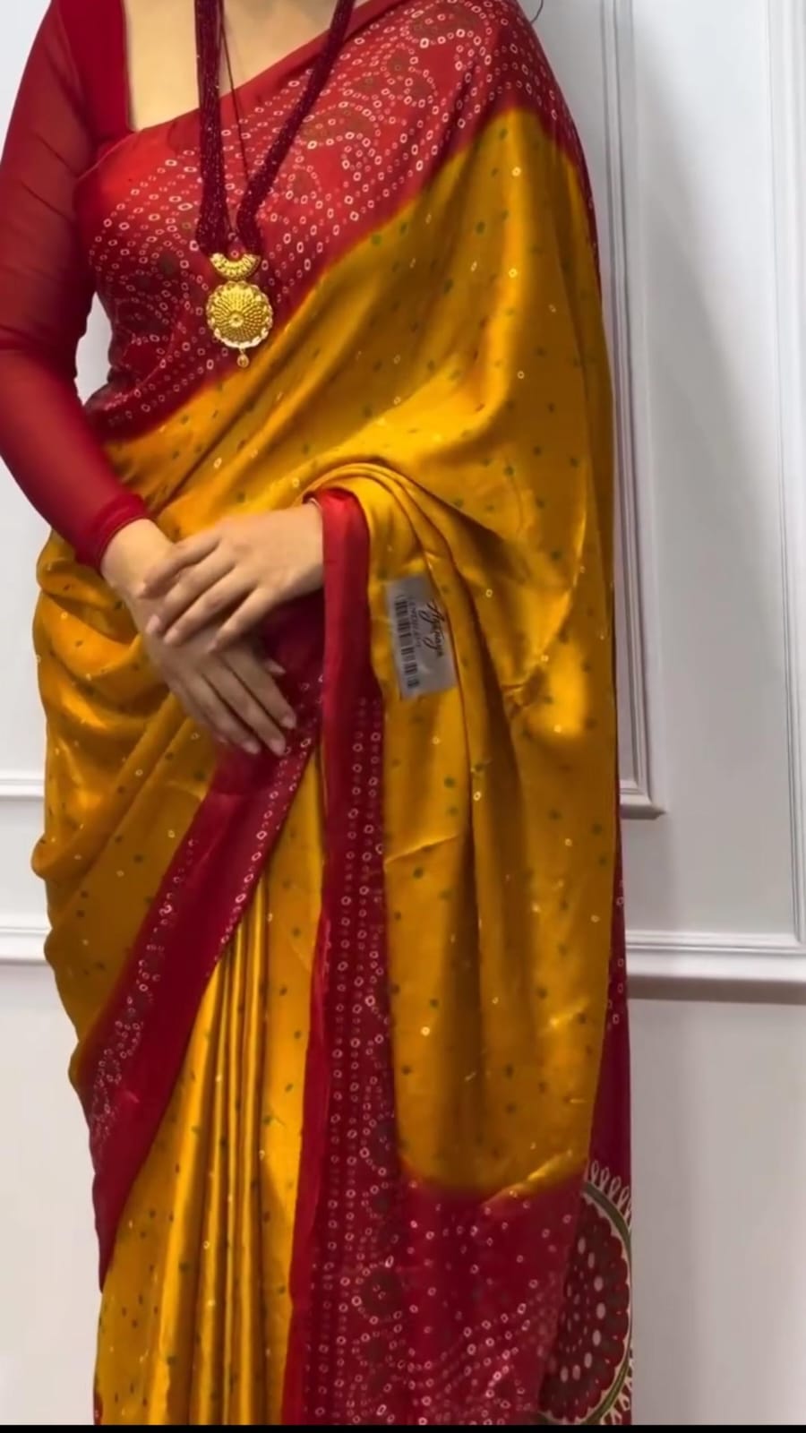 Mustard and red bandhani saree.