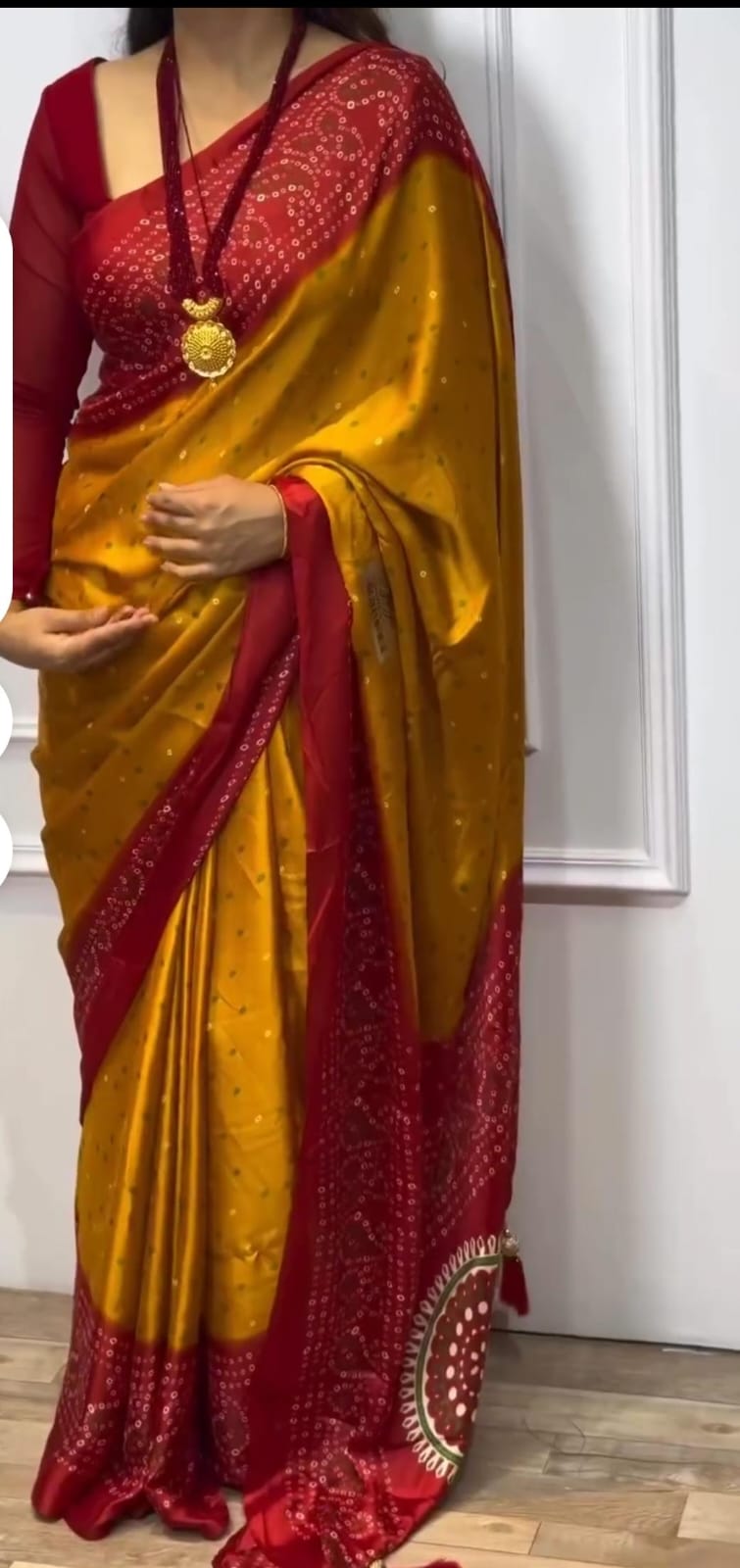 Mustard and red bandhani saree.