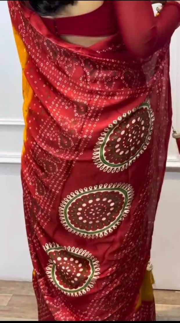 Mustard and red bandhani saree.